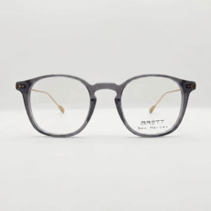 Translucent gray eyeglasses with rounded-rectangle frames, BRETT Neo Heroes logo on the right lens.