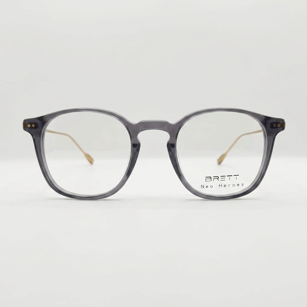 Translucent gray eyeglasses with rounded-rectangle frames, BRETT Neo Heroes logo on the right lens.