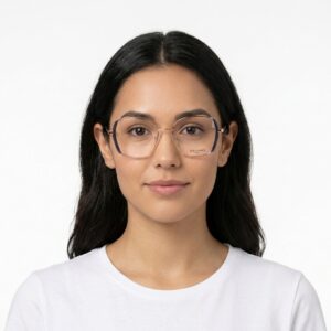 Portrait of a woman with dark hair wearing pink-rimmed glasses and a white shirt, looking at the camera.